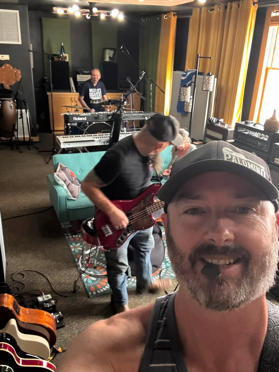 Three musicians working together in the Giant Juniper Studio live room