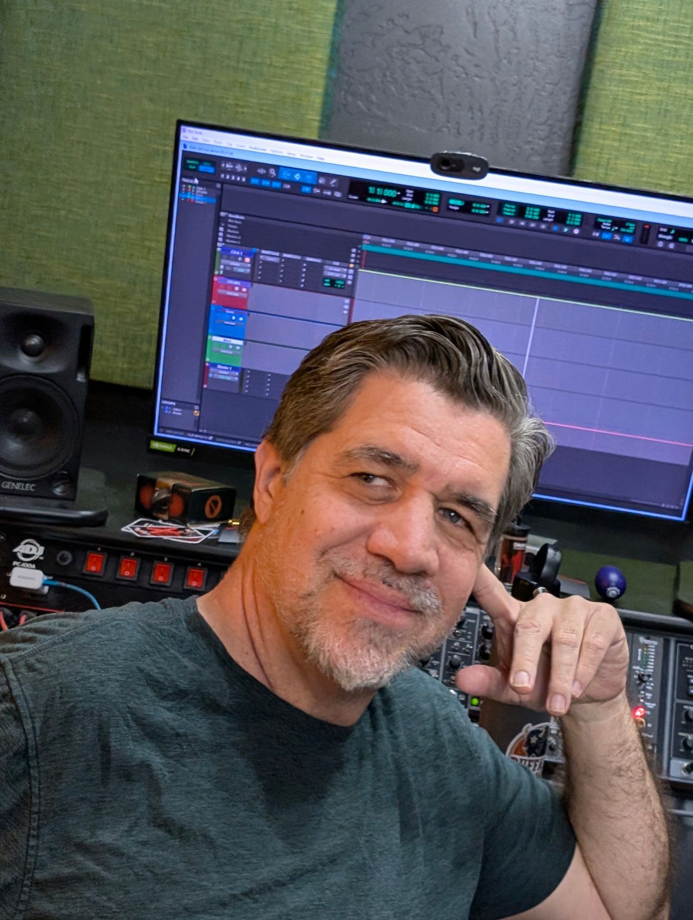 An engineer in front of the studio console during a session