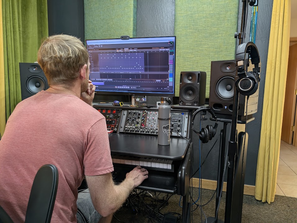 An engineer working on a session at the studio console