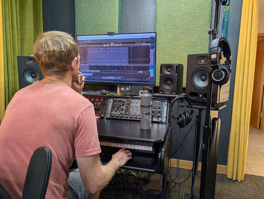 A Giant Juniper Studio engineer listening at the recording console